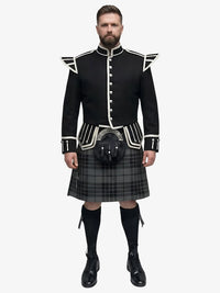Man wearing a black doublet Highland dress with white trim on a white background