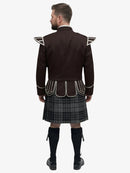 Man wearing a dark brown jacket with white accents and a grey watch tartan plaid kilt on a white background