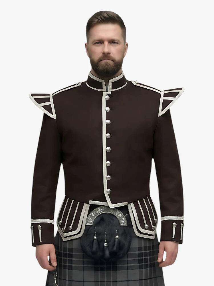 Man wearing a dark brown jacket with white trim and a grey watch tartan plaid kilt on a white background