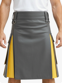 Gray and yellow kilt worn by a person on a plain background