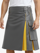 Gray kilt with yellow lining worn by a person on a white background