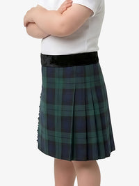 Person wearing a green plaid skirt with a white top on a white background