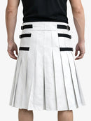 White pleated skirt with black straps worn by a person on a white background