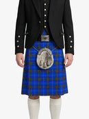 Person wearing a blue plaid kilt with a black jacket on a white background