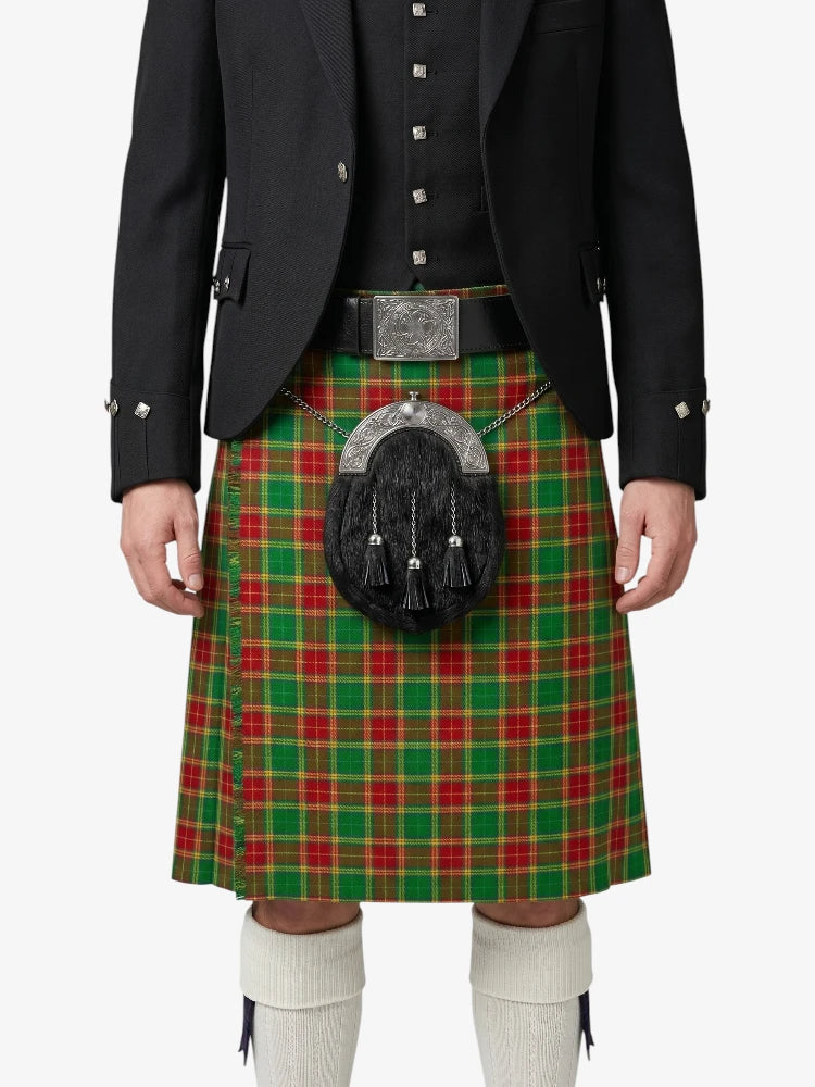 Person wearing a red and green plaid kilt with a black jacket on a white background