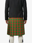 Person wearing a black jacket and red plaid kilt on a white background