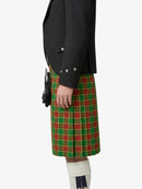 Person wearing a black jacket and green plaid kilt on a white background