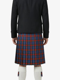 Person wearing a black jacket and red and blue plaid kilt on a white background