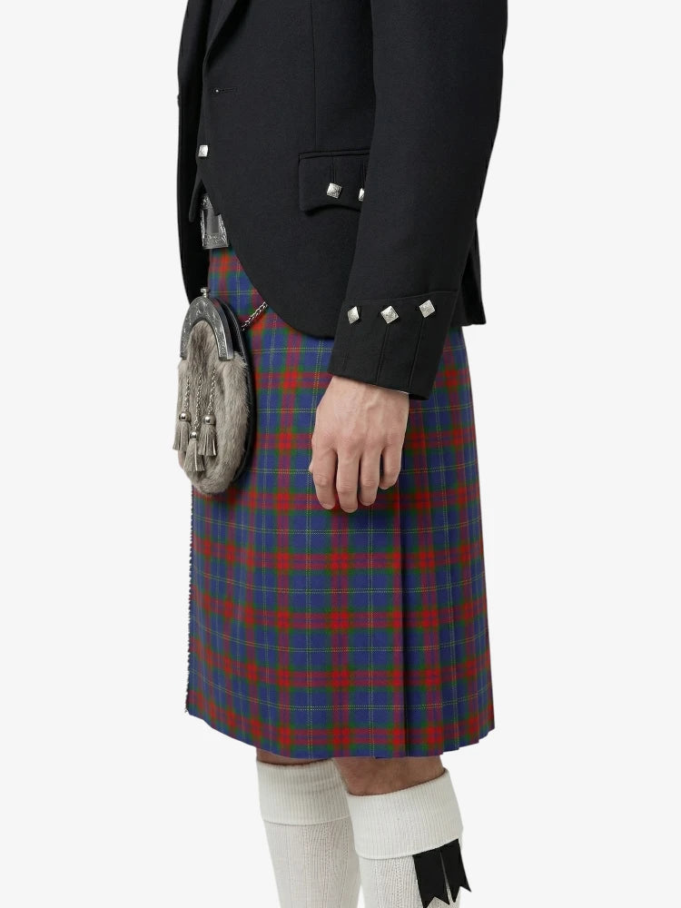 Person wearing a traditional Scottish kilt with a sporran on a white background