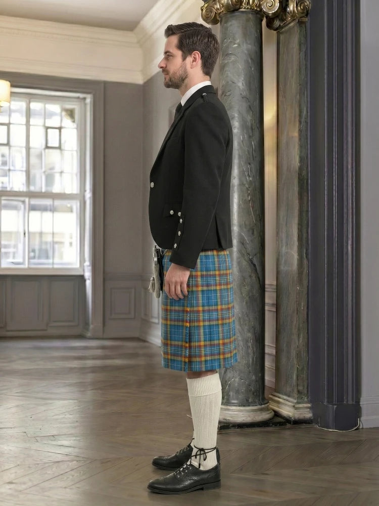 Man wearing a traditional kilt in an elegant interior setting