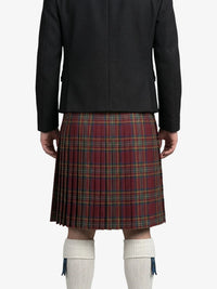 Person wearing a black jacket and red plaid kilt on a white background