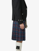Person wearing a black jacket and plaid kilt on a white background