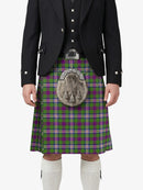 Person wearing a Scottish kilt with a tartan pattern on a white background