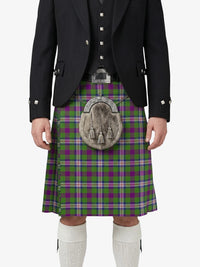 Person wearing a Scottish kilt with a tartan pattern on a white background