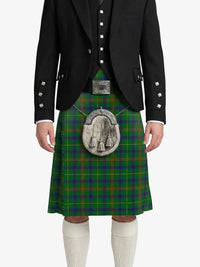 Person wearing a traditional Scottish kilt with a black jacket on a white background