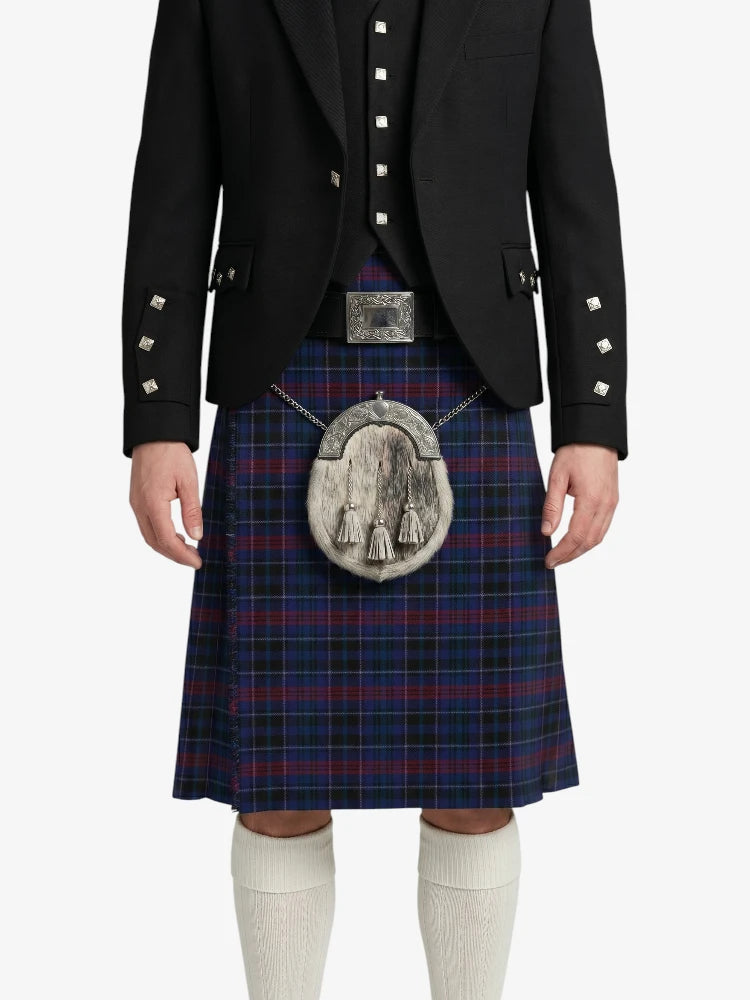 Person wearing a traditional Scottish kilt with a jacket on a white background