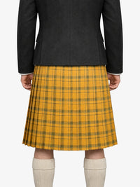 Person wearing a black coat and yellow plaid kilt on a white background