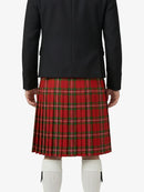 Person wearing a black jacket and red plaid skirt on a white background
