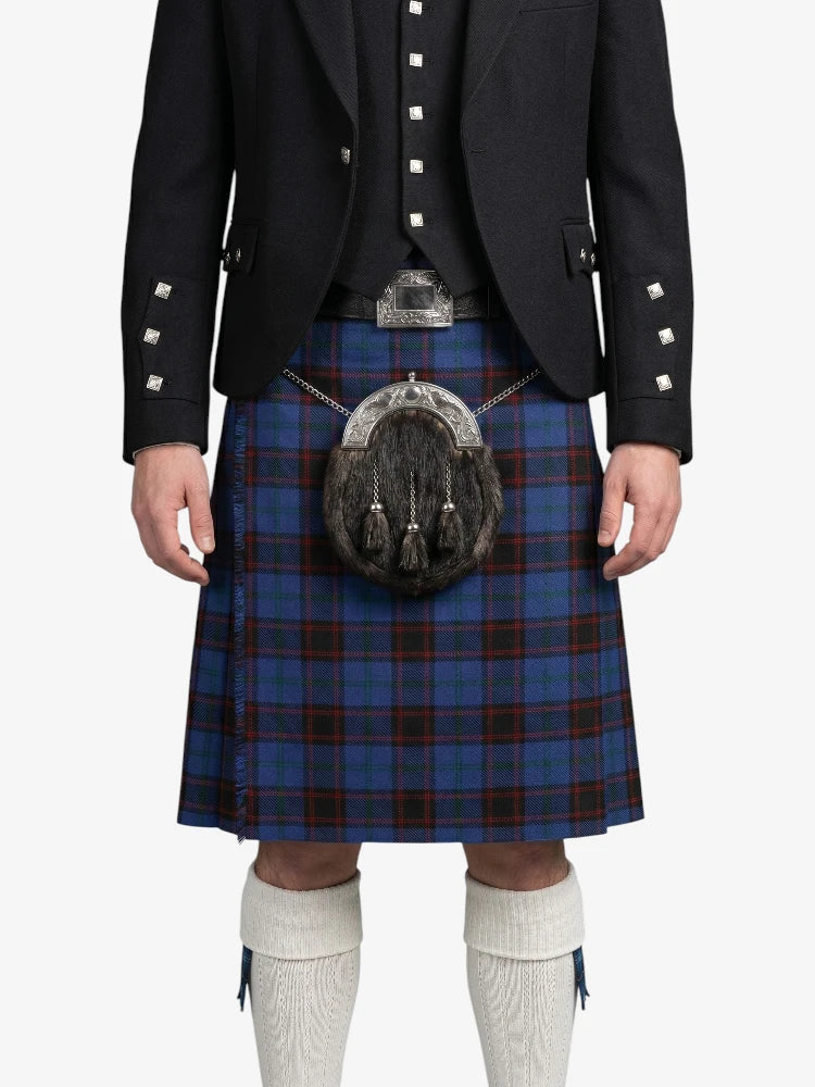 Person wearing a traditional Scottish kilt with a sporran on a white background