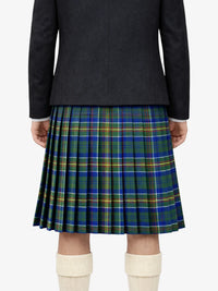 Person wearing a black jacket and blue and green plaid kilt on a white background