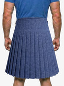 Person wearing a blue pleated skirt on a white background