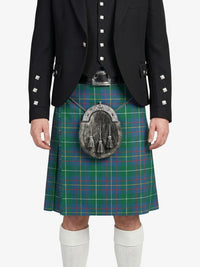 Person wearing a traditional Scottish kilt with a plaid pattern on a white background