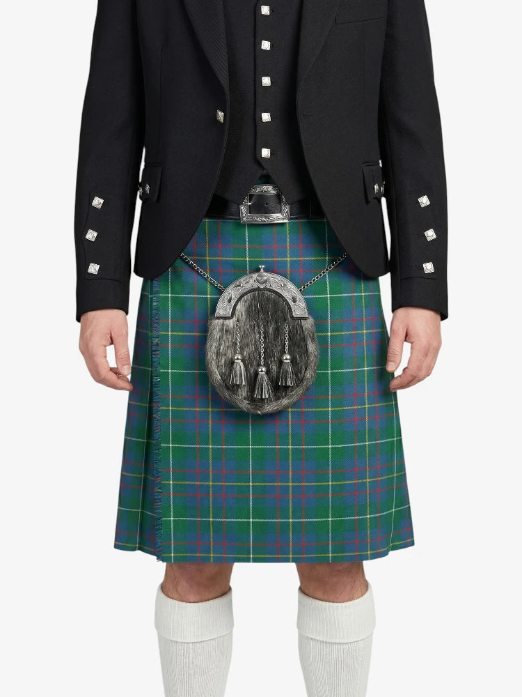 Person wearing a traditional Scottish kilt with a plaid pattern on a white background
