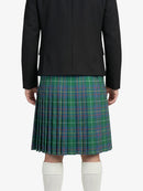 Person wearing a black jacket and green plaid kilt on a white background