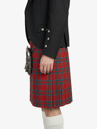 Person wearing a red tartan kilt with a black jacket on a white background