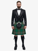 Man wearing a traditional Scottish irish national tartan kilt with a black prince charlie jacket on a white background