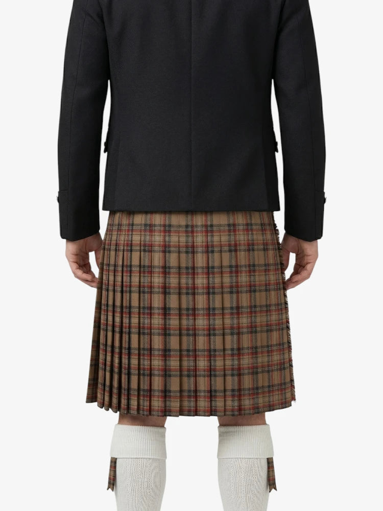 Person wearing a black jacket and plaid kilt on a white background