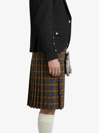 Person wearing a black blazer and plaid kilt on a white background