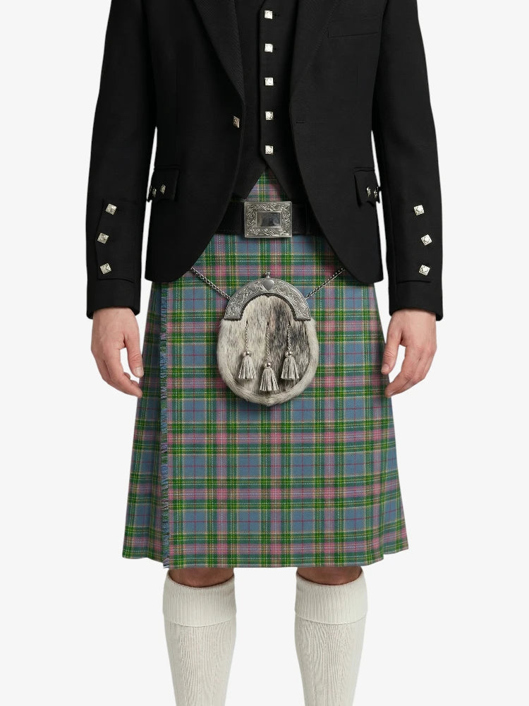 Person wearing a black jacket and green plaid kilt with a white background