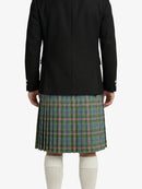 Person wearing a black jacket and plaid kilt on a white background