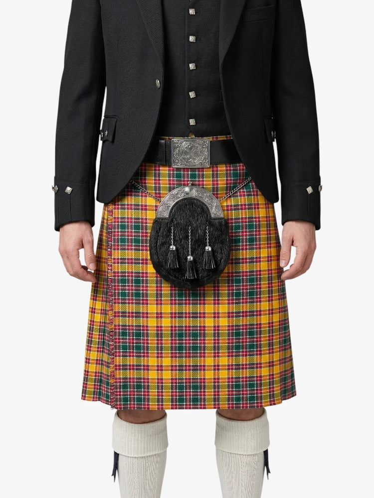 Person wearing a traditional Scottish kilt with a tartan pattern on a white background