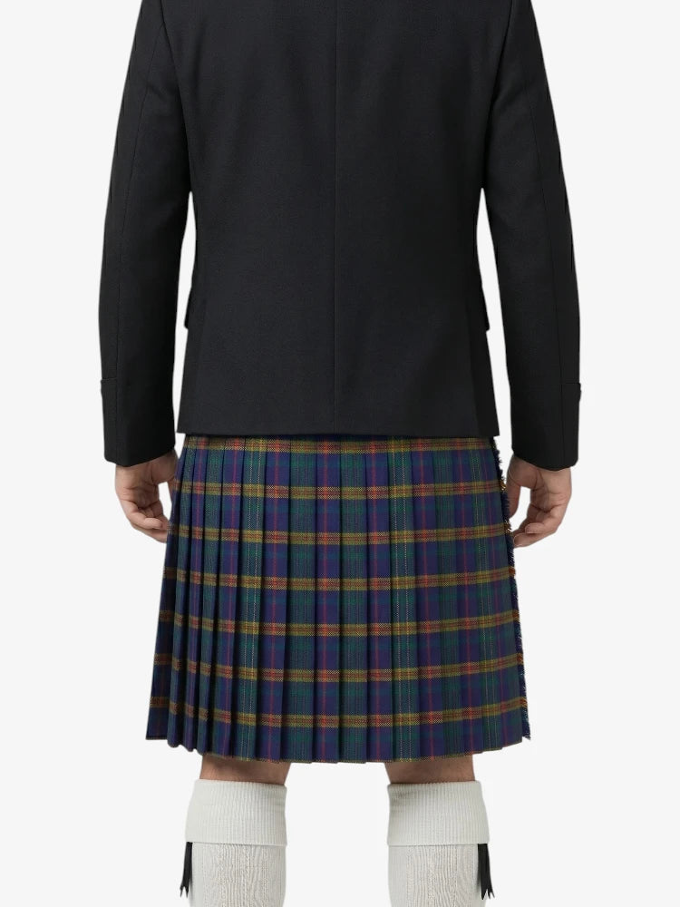 Person wearing a black jacket and plaid kilt on a white background