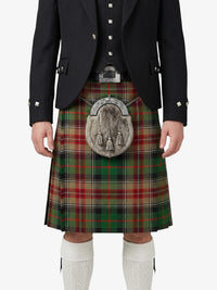 Person wearing a traditional Scottish kilt with a tartan pattern on a white background