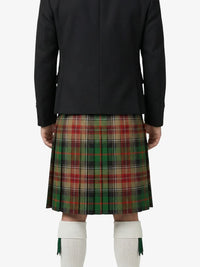 Person wearing a black jacket and plaid kilt on a white background