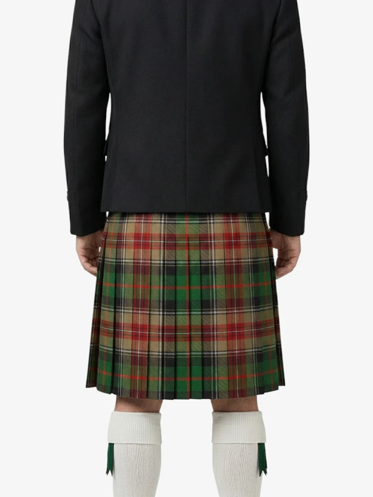 Person wearing a black jacket and plaid kilt on a white background