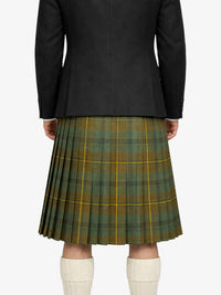 Person wearing a black coat and green plaid kilt on a white background