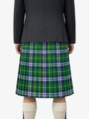 Person wearing a black and green plaid skirt on a white background