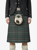 Person wearing a traditional Scottish kilt with a sporran on a white background