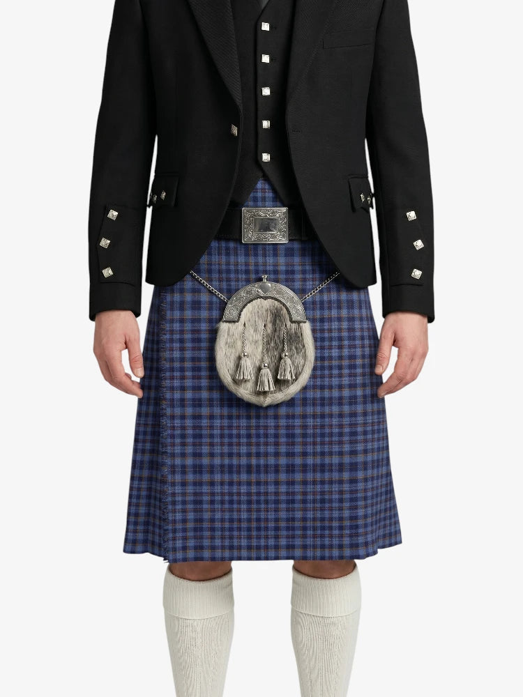 Person wearing a traditional Scottish kilt with a jacket on a white background