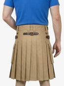 Person wearing a beige pleated kilt with a brown belt on a white background