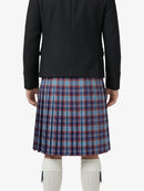 Person wearing a black jacket and plaid kilt on a white background