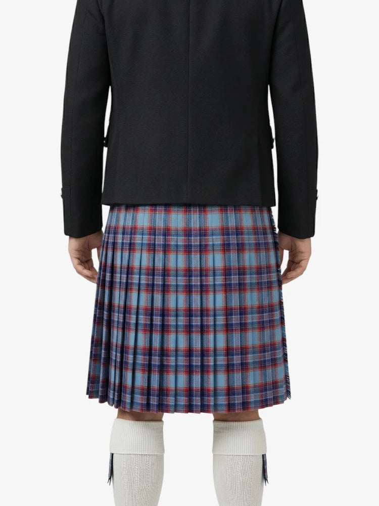 Person wearing a black jacket and plaid kilt on a white background