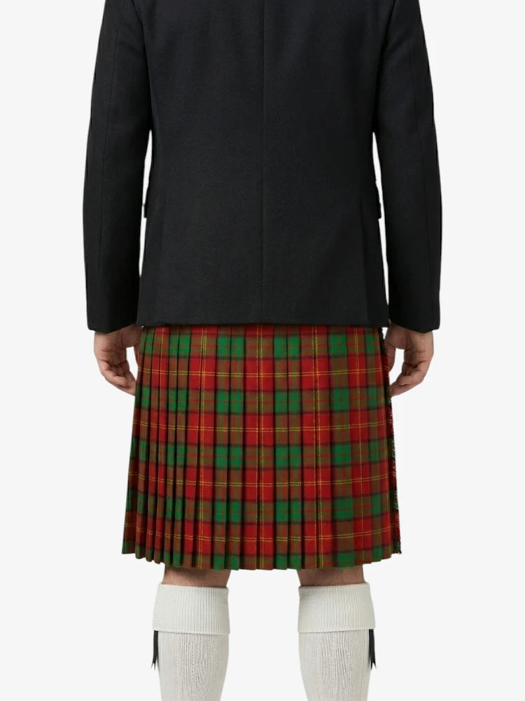 Person wearing a black coat and red plaid kilt on a white background