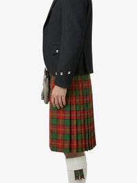 Person wearing a black jacket and red plaid kilt on a white background