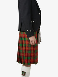 Person wearing a dark jacket and red plaid kilt on a white background