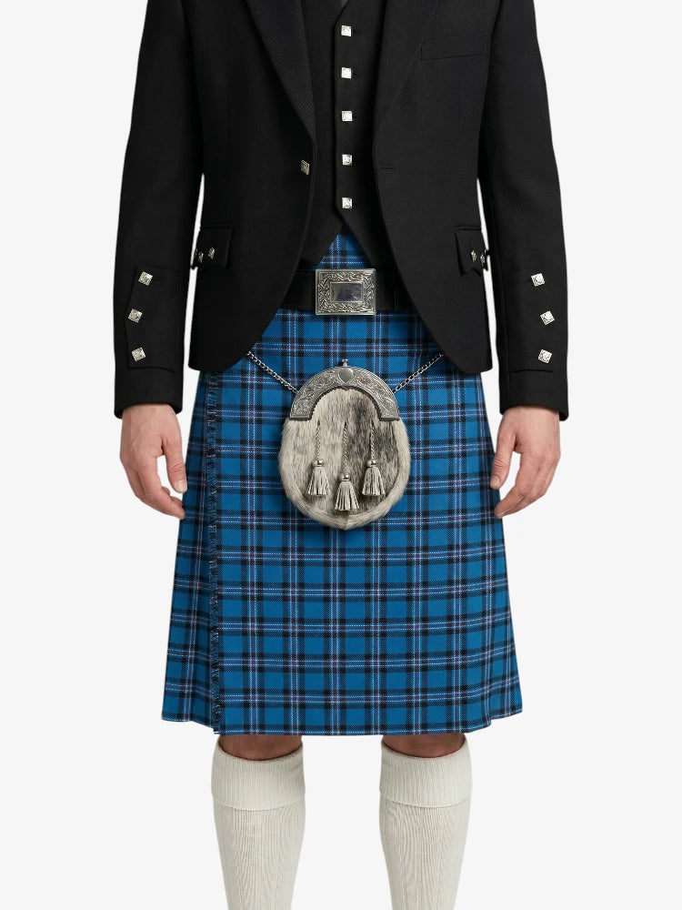 Person wearing a blue plaid kilt with a black jacket on a white background